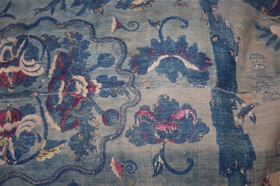 A blue brocade figurative hanging with metal thread embroidery and velvet border